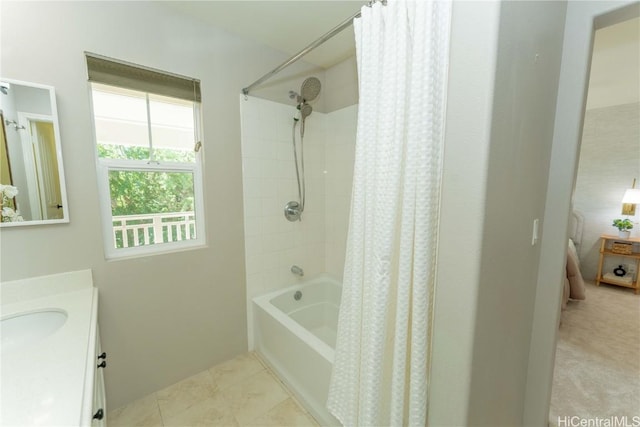 bathroom featuring vanity and shower / bathtub combination with curtain