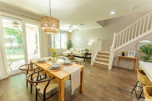 dining space with dark hardwood / wood-style floors and ceiling fan