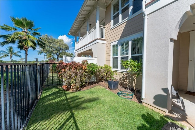 view of yard featuring a balcony