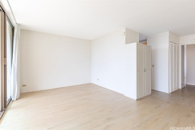 unfurnished room featuring light hardwood / wood-style floors