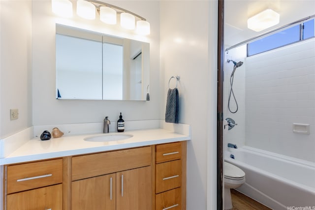 bathroom featuring vanity, toilet, and shower / bath combination