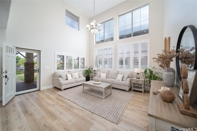 sunroom featuring a notable chandelier