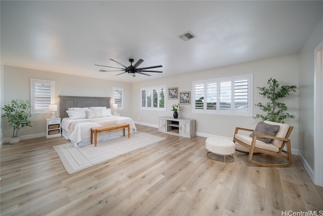 bedroom with ceiling fan and light hardwood / wood-style floors