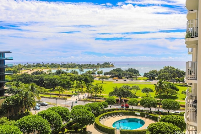 view of swimming pool featuring a water view