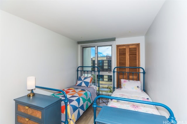 bedroom with hardwood / wood-style floors