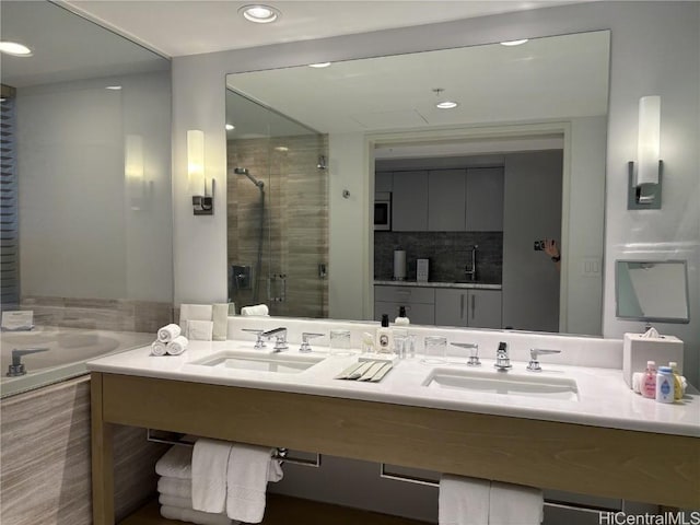 bathroom with vanity and separate shower and tub