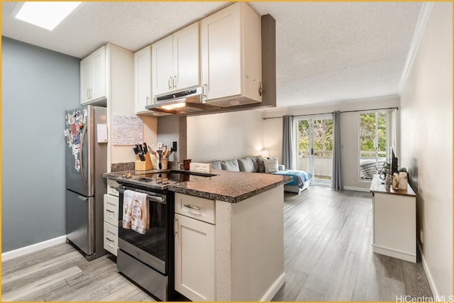 kitchen featuring stainless steel appliances, light wood-type flooring, and white cabinets