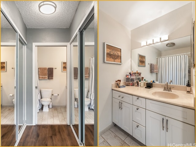 bathroom with toilet, wood-type flooring, vanity, a textured ceiling, and an enclosed shower