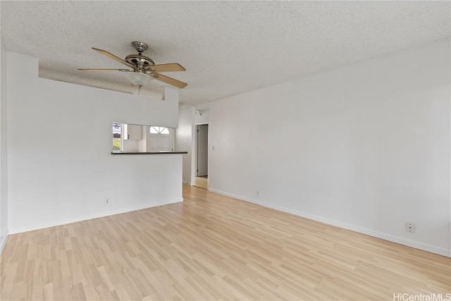 unfurnished room with light wood-type flooring, a textured ceiling, and ceiling fan