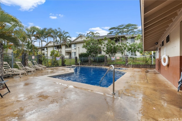 view of swimming pool featuring a patio area