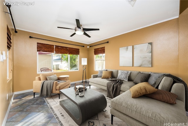 living room featuring ceiling fan and ornamental molding