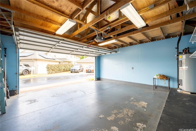 91-6500 Kapolei Pkwy, Ewa Beach, HI 96706 - garage featuring baseboards, electric water heater, and a garage door opener