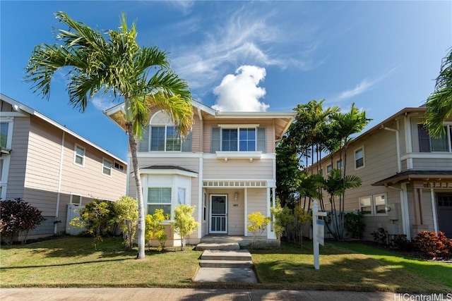 view of front of property featuring a front yard