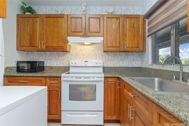 kitchen with electric stove, sink, and light stone counters