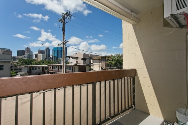 balcony featuring a wall unit AC