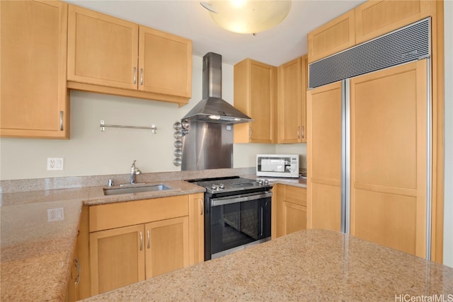 kitchen featuring light brown cabinets, wall chimney exhaust hood, sink, paneled built in refrigerator, and electric stove