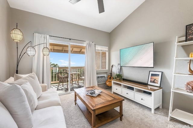 living room featuring an AC wall unit, light carpet, ceiling fan, and vaulted ceiling