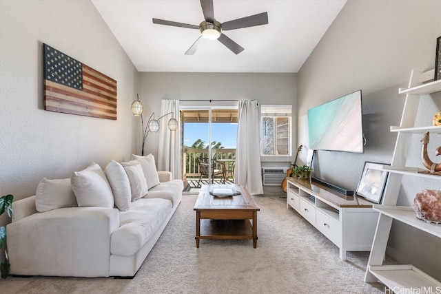 living room with ceiling fan, light colored carpet, lofted ceiling, and an AC wall unit