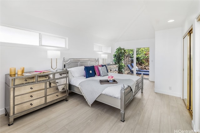 bedroom with access to outside and light hardwood / wood-style floors