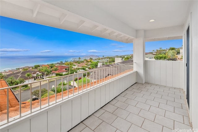 balcony featuring a water view