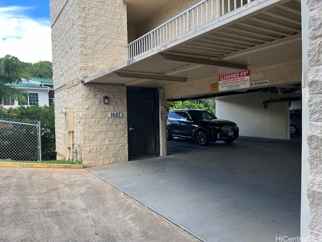 garage featuring a carport