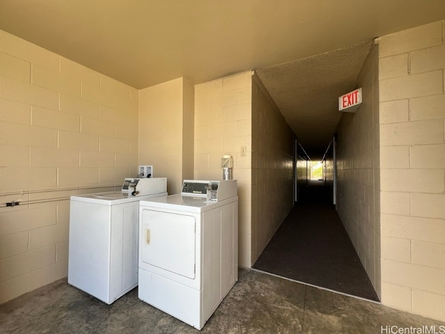 laundry room featuring washing machine and clothes dryer