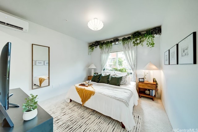 bedroom featuring a wall unit AC and light colored carpet