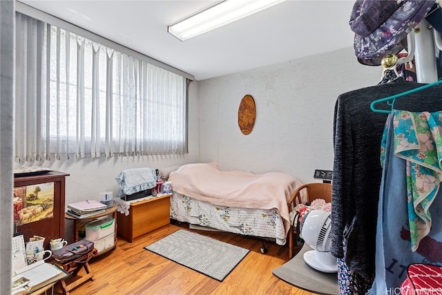 bedroom with hardwood / wood-style floors