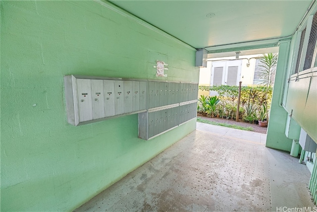 exterior details featuring concrete flooring and mail boxes