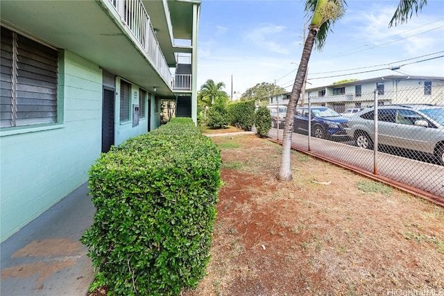 view of yard with a balcony