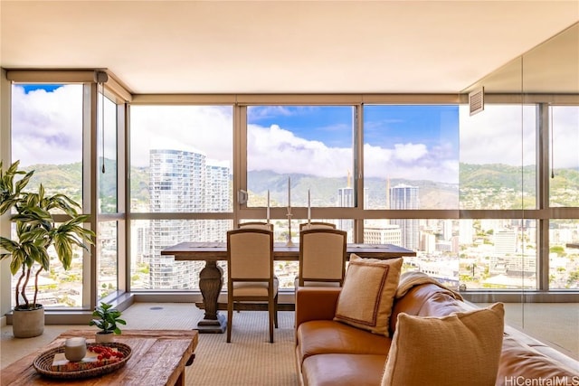 sunroom featuring a city view