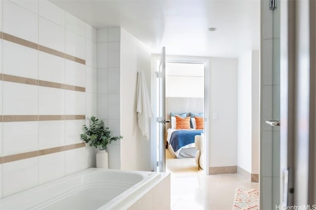 ensuite bathroom featuring a garden tub, ensuite bath, and tile patterned floors