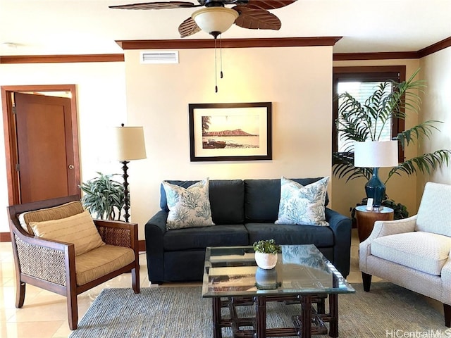 living room featuring ceiling fan, crown molding, and tile patterned flooring