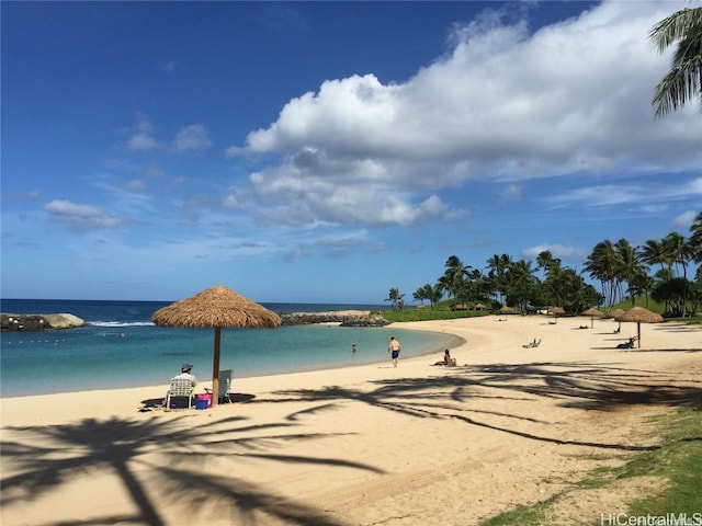 property view of water featuring a beach view