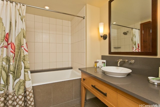 bathroom featuring vanity and shower / bath combination with curtain