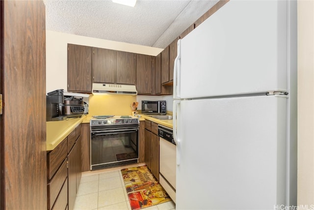 kitchen featuring a textured ceiling and black appliances