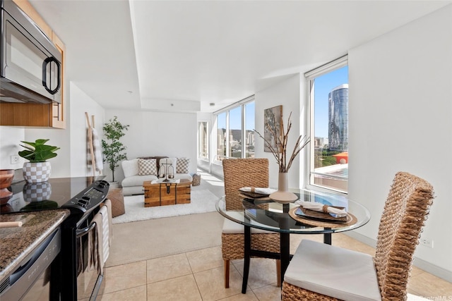 interior space featuring light tile patterned flooring and a city view
