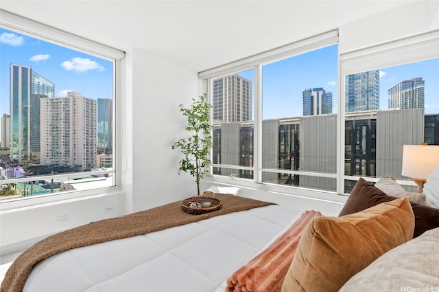 bedroom featuring a city view