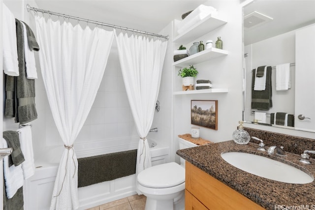 full bathroom featuring tile patterned flooring, vanity, shower / tub combo, and toilet