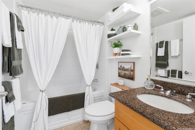 full bathroom with tile patterned floors, toilet, visible vents, shower / tub combo, and vanity