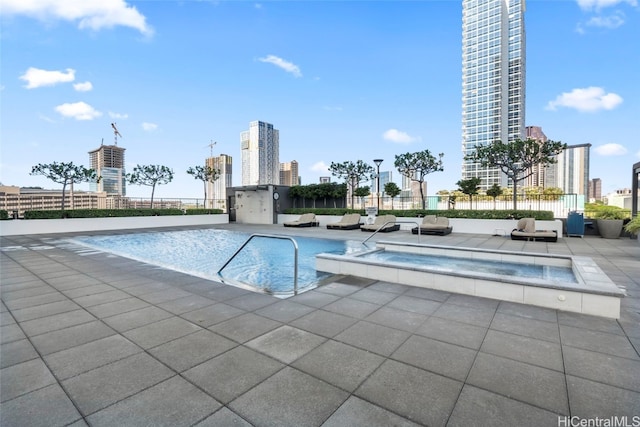 view of swimming pool featuring a patio