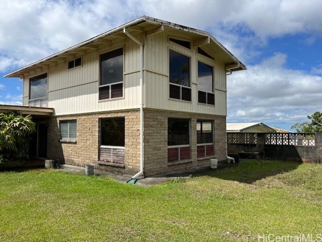 back of property with a yard