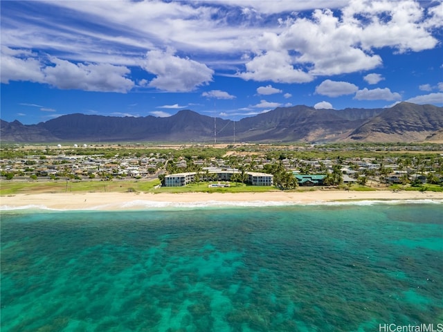 view of pool with a water and mountain view and a view of the beach