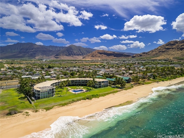 mountain view featuring a water view and a beach view