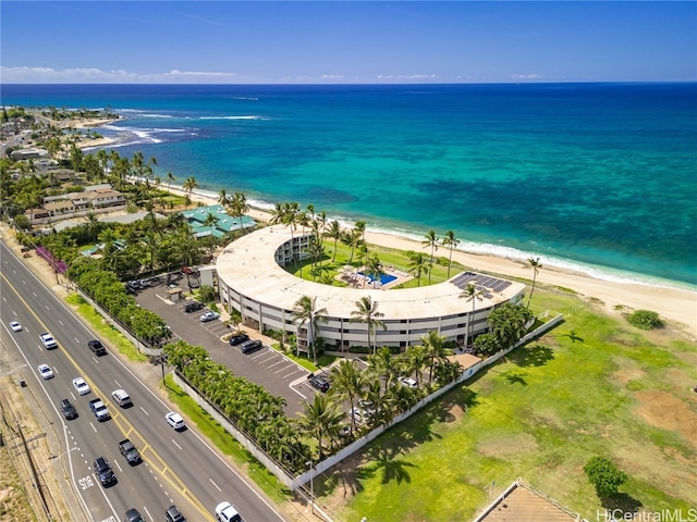 bird's eye view featuring a view of the beach and a water view