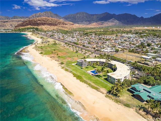 aerial view with a beach view and a water and mountain view