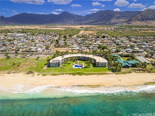 birds eye view of property with a beach view and a water and mountain view