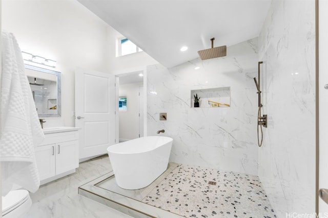 bathroom featuring plus walk in shower and vanity