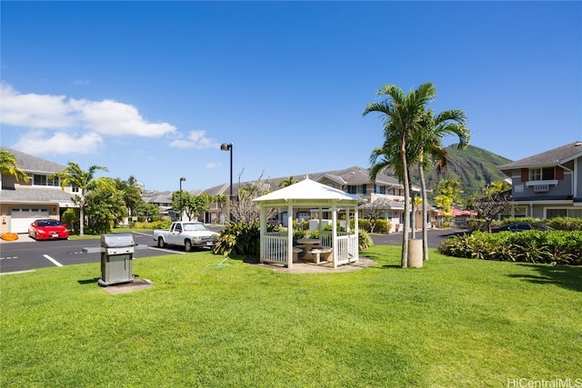 view of yard featuring a gazebo and a garage