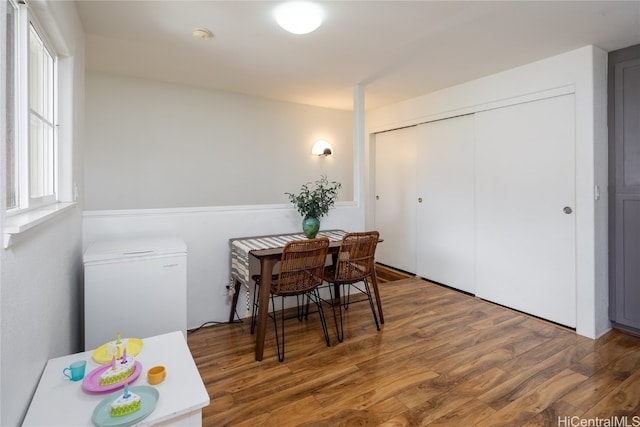 dining space with hardwood / wood-style flooring and a wealth of natural light